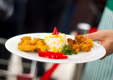 person-with-platyye-prepared-food_enhanced UHY Al Mousa